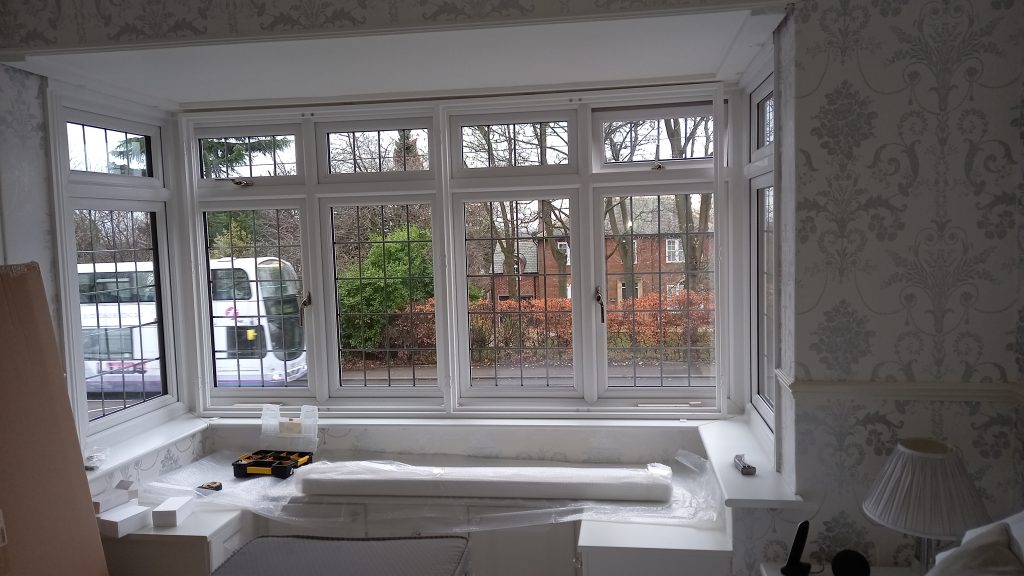 Shutter Up Your Place - During installation on a square window with window seat 